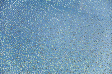 View of a broken glass in front of sky, office building, glass roof, glass pool. Perfect background