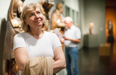 Senior woman looking at exhibit