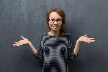 Portrait of perplexed caucasian young woman