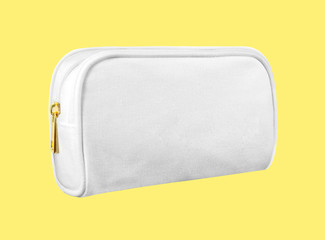 blank cosmetic case bag, white zip bag isolated on yellow background