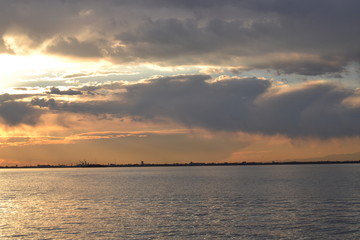 Beautiful sunset and clouds over the lagoon in the area of Venice.