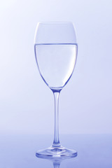 wine glass of water on light background. tableware for drinks.