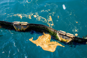 Sea pollution, waste oil on the sea, pontoon sea barrier