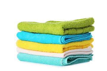 Stack of folded towels on white background