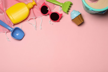 Flat lay composition with beach toys on color background. Space for text