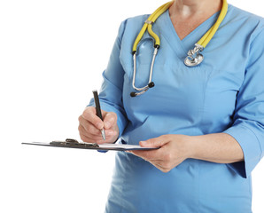 Closeup of female doctor in scrubs with clipboard isolated on white. Medical staff