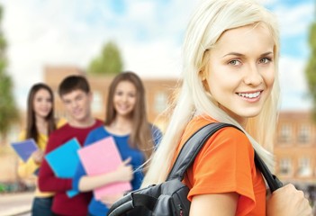 Young female student with people on background