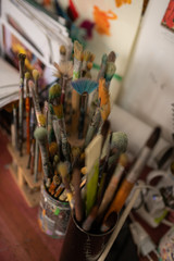 Top view of varied professional painting brushes of famous artist