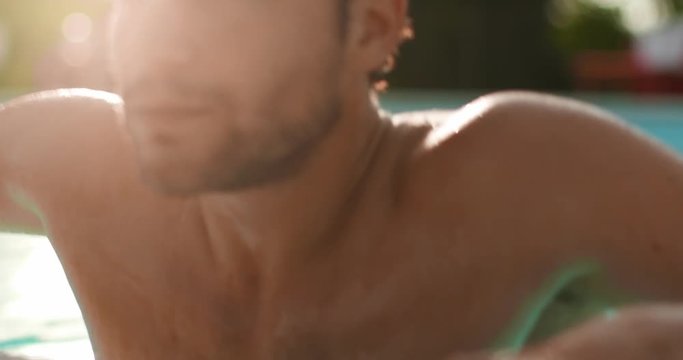 Man into water relaxing and getting out from swimming pool in sunny day.Friends italian trip in Umbria.4k slow motion