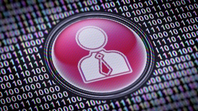 Person icon. Binary code ( array of bits ) in the screen. Looping footage with Prores4444.