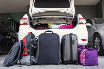 Prepared suitcases and bags before loading to trucnk of car. Travel concept.