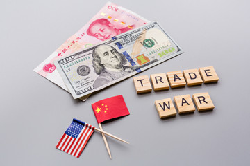 Creative top view flat lay of China and USA flags and cash money, mockup and copy space on gray background in minimal style. Concept of trade war between USA and China