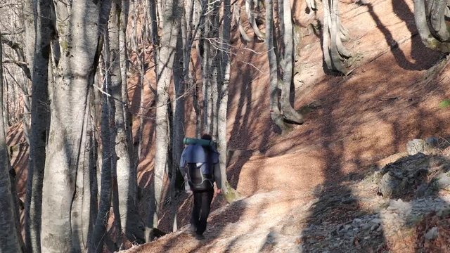Hiking from the famous Valbona to Theth valley. Valbone to Thethi in the Albanian Alps. Man backpacking and camping in the mountains.