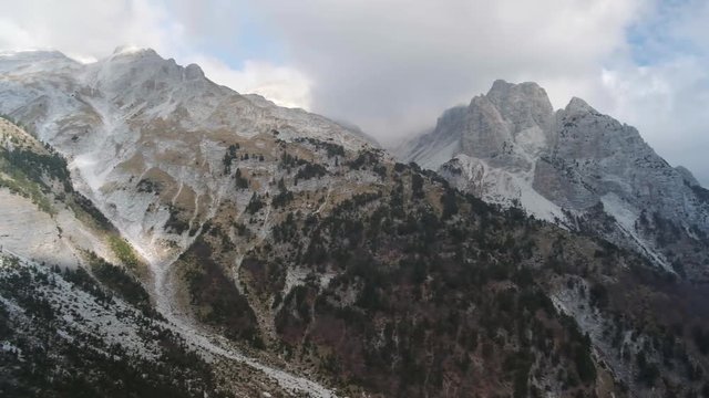 Hiking from the famous Valbona to Theth valley. Valbone to Thethi in the Albanian Alps. Man backpacking and camping in the mountains.