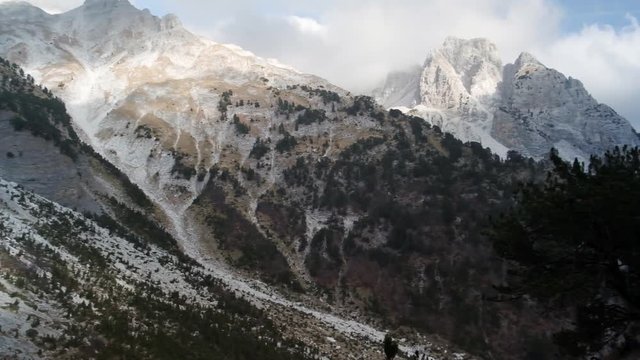 Hiking from the famous Valbona to Theth valley. Valbone to Thethi in the Albanian Alps. Man backpacking and camping in the mountains.