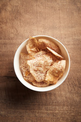 Fried taro chip on wood background