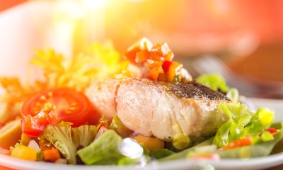 Delicious fried meat with salad on plate, close up