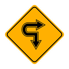 arrow road sign in yellow signage