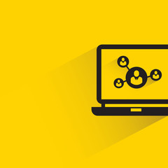 people network in laptop with shadow on yellow background