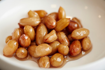 Pickled peanut on white dish 