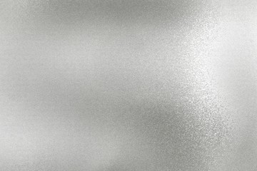 Glowing silver foil metal wall surface, abstract texture background