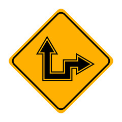 arrow road sign in yellow signage