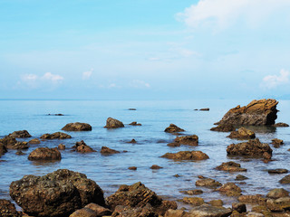 Close up rocks on summer sea and blue sky background.
