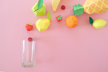 exotic fruits made of paper on pink background