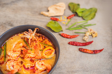Prawn and lemon grass soup with mushrooms,Tom Yam Kung ,thai food in wooden background, top view