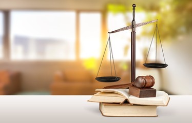 Justice Scales and books and wooden gavel on table. Justice concept