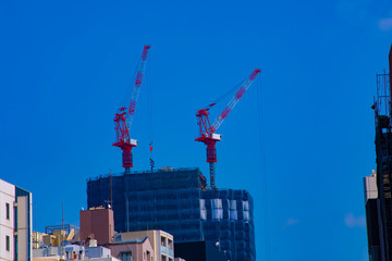 Crane at the under construction behind the blue sky in Tokyo