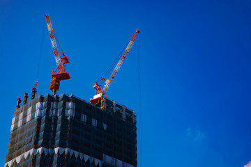 Crane at the under construction behind the blue sky in Tokyo