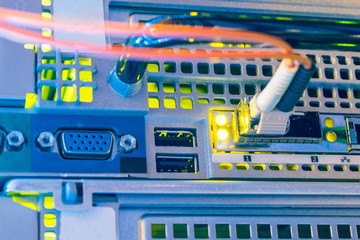 Back panel of modern server hardware. The fiber optic patchcord is connected to the modular...
