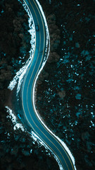 Aerial View of Road and Forest in Snow