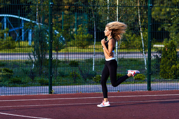 Sport girl. The girl is doing fitness exercises. Beautiful young sports woman doing exercises. A...