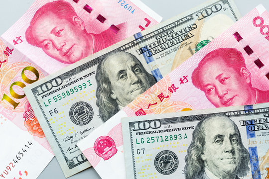 US Dollar And Chinese Yuan Bank Note. Trade War And Conflict Between Two Big Countries. USA And China Relationship. Concept. Copy Space Leader