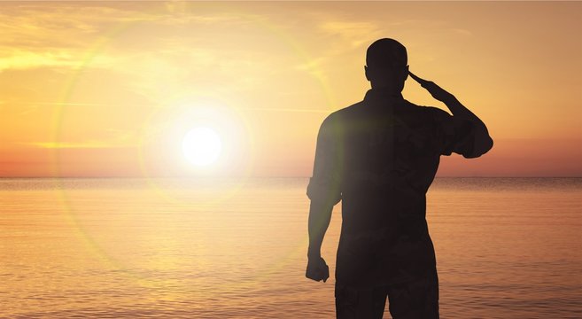Young military soldier man silhouette on background