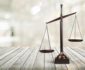 Law scales on table background. Symbol of justice
