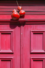 Detail of red door entrance in Porto, Portugal
