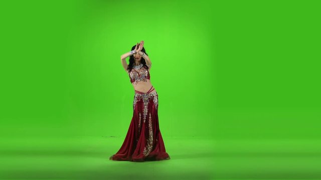 Energetic dancing woman sexually moves her semi-nude body