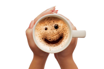 Women's hand holding a cup of coffee smile face frome - obrazy, fototapety, plakaty