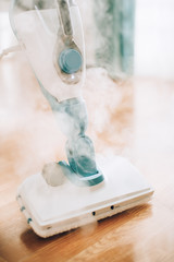 Steam cleaner mop cleaining floor. Banner with copy space. Cleaning service concept