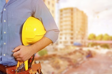 Male worker with tool belt isolated on white  background