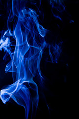 Blue toxic fumes movement on a black background.