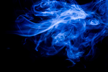 Blue toxic fumes movement on a black background.