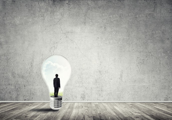 Obraz premium Businessman trapped in bulb