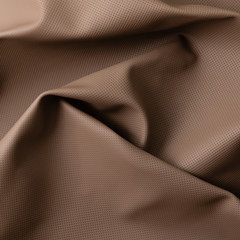 Closeup of light color leather material texture background