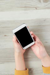 Female hands using a smartphone.  スマートフォンを使う女性の手