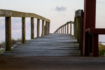 Fototapeta na wymiar wooden bridge over sand dune