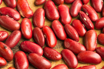 Red beans on wood background